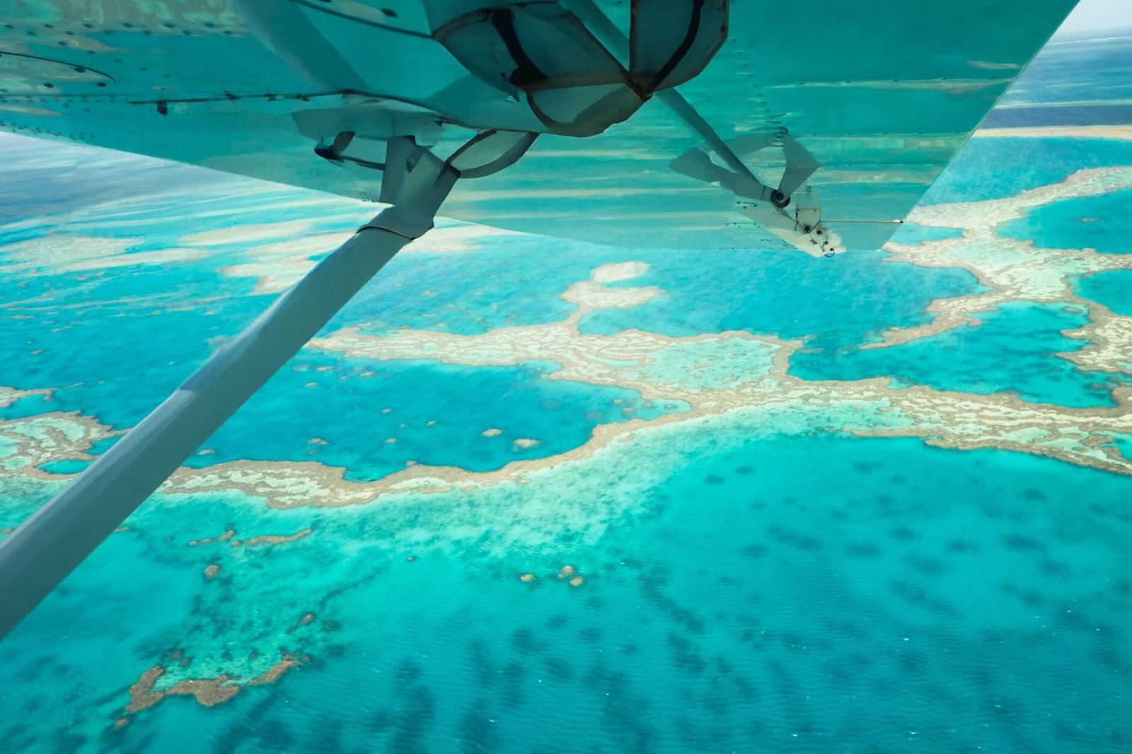 Stunning aerial shot of the vibrant Great Barrier Reef, showcasing turquoise waters.